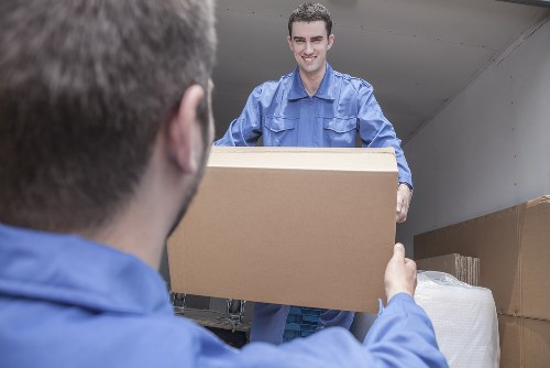 Loading boxes and furniture into a local removal van