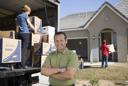 Movers carrying items through a central London building with careful access planning