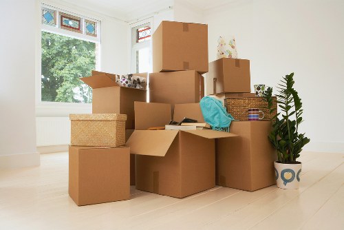Packed office boxes and furniture ready for a business move in Knightsbridge